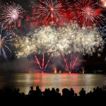 beautiful-large-colorful-fireworks-display-with-unrecognizable-crowd-people-watching