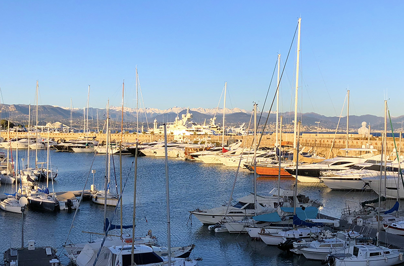 Yachts and mountain views at the Antibes harbor