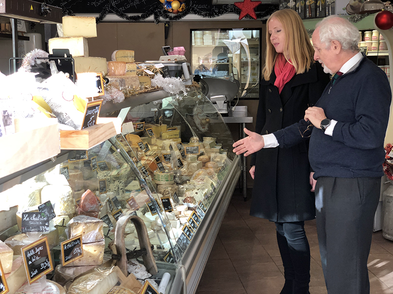 Darley with her local guide in the Cannes cheese market