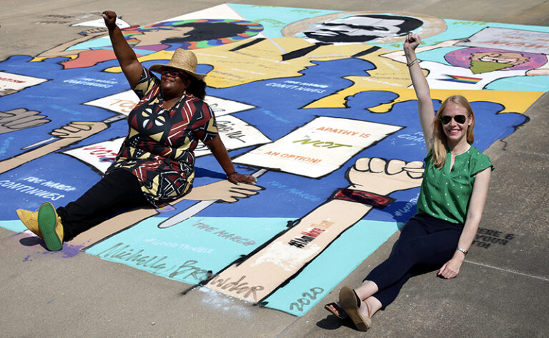 Darley with artist and activist Michelle Browder at her mural at the Southern Poverty Law Center.