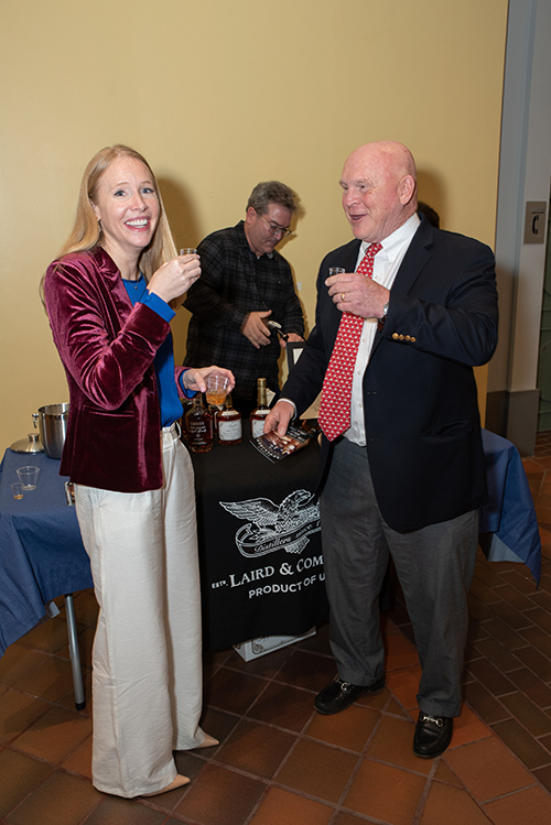 Darley tastes Laird's Applejack and other colonial inspired food and drinks with Kevin Wensing during the reception.