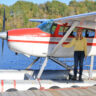 Darley Newman rides in a seaplane in Québec