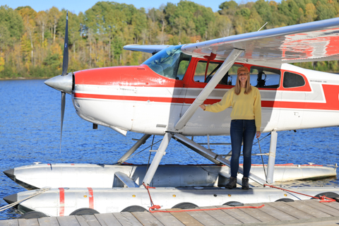 Darley Newman rides in a seaplane in Québec