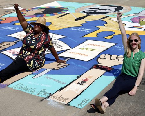 Darley with artist and activist Michelle Browder at her mural at the Southern Poverty Law Center.